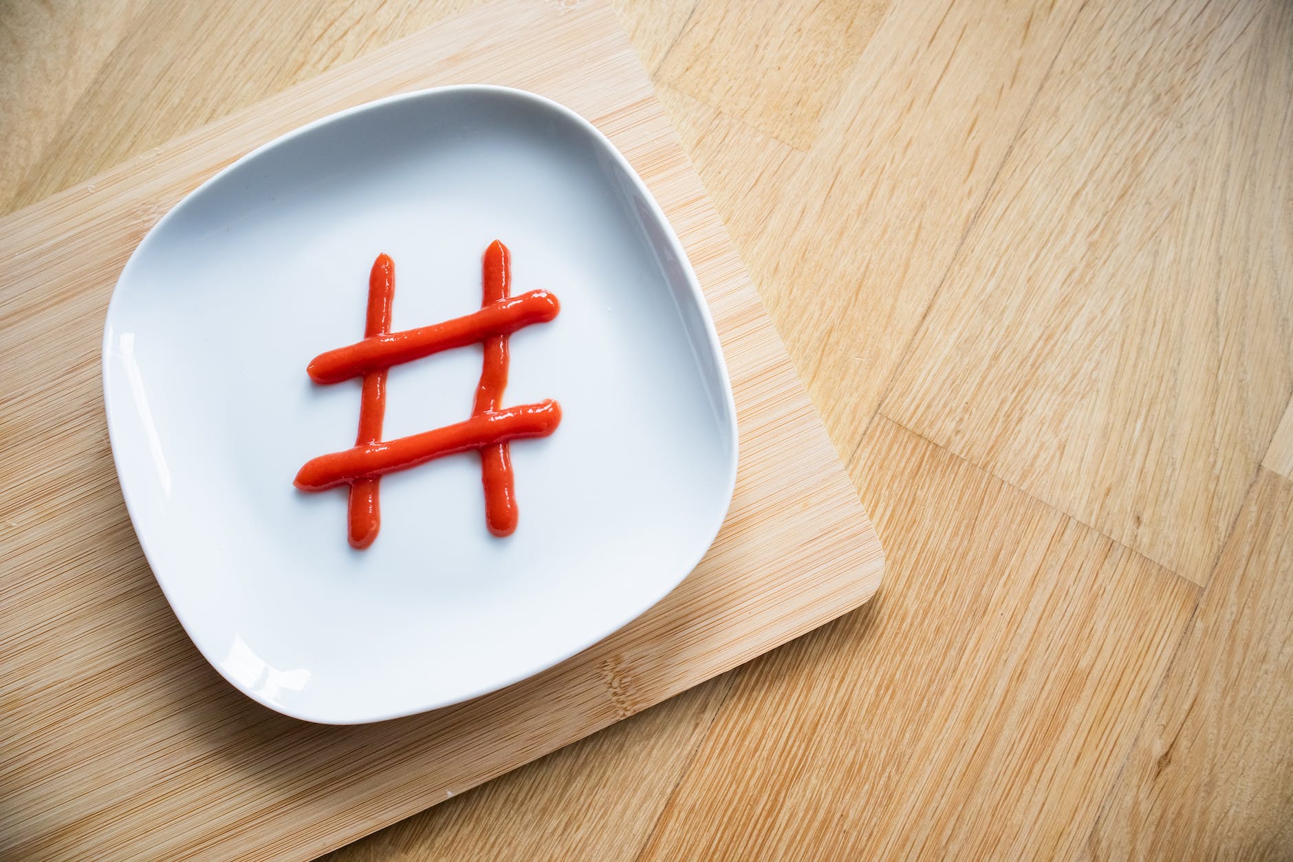 hashtag made from ketchup on white plate